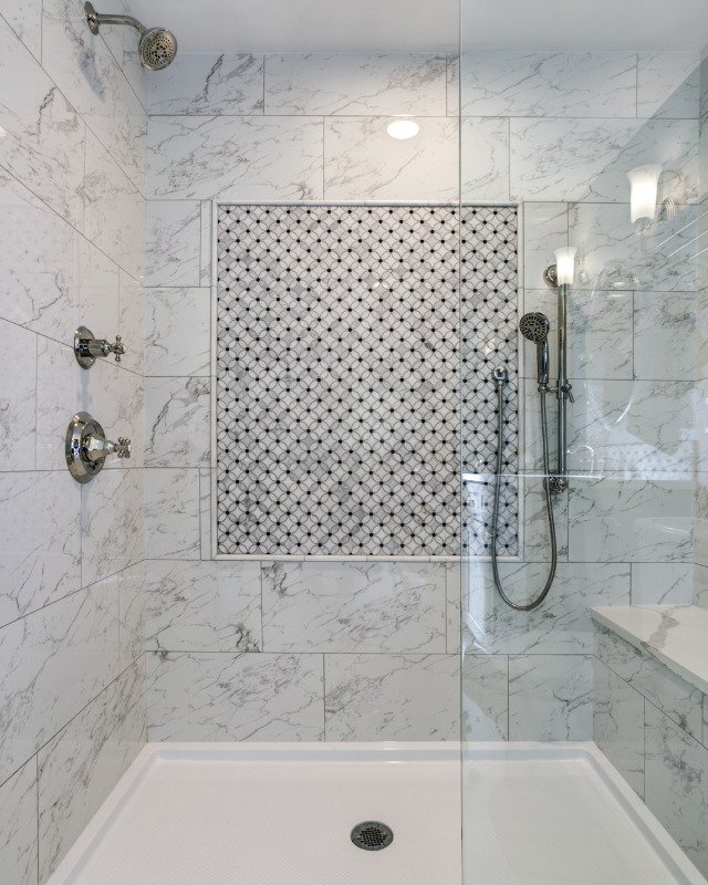 Image showcasing a walk-in shower with a Carrera Marble Surround in Toms River, NJ.